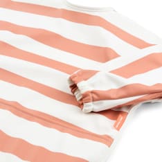 Done by Deer Striped papaya bib with sleeves