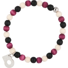 The pure design of Herkkä bracelet has one shiny metal bead among the string of wooden beads. Ø 5 cm, flexible. Handmade in...