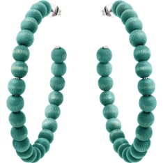 The dashing Sofia earrings have small wooden beads threaded into a silvery loop. Ø 6,5 cm. Handmade in Finland.
</li><li>Ma...